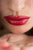 Close-up of air kiss with red lips