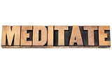 meditate word in wood type