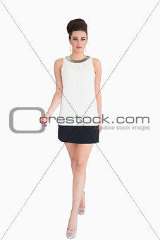 Woman in white dress walking