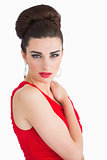 Woman with red dress touching her shoulder