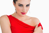 Woman with red dress looking serious