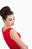 Woman wearing a red dress and earrings