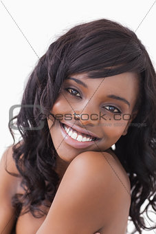 Woman smiling over the shoulder