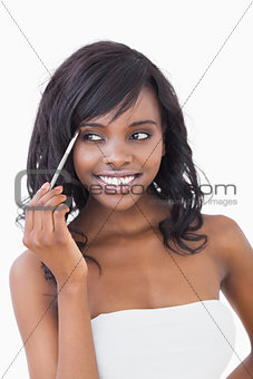 Woman using eye shadow brush