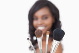 Woman holding brushes