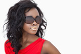 Woman wearing sunglasses and a red dress