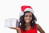 Woman standing holding a Christmas present