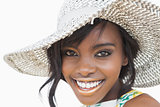 Woman wearing summer hat smiling