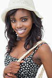 Woman wearing summer hat and black flower dress