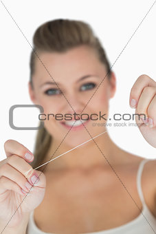 Woman holding dental floss