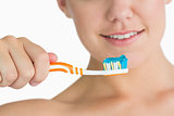 Woman holding the toothbrush