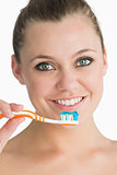 Smiling woman holding toothbrush