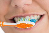 Close up of mouth and toothbrush