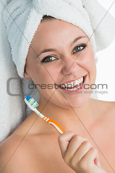 Woman with hair towel smiling