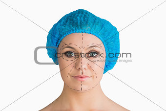 Woman with hair net and black dashes lines for a face lift