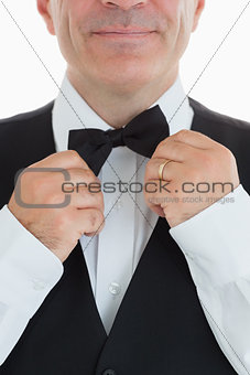 Waiter adjusting his bow tie
