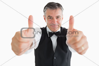 Glad waiter with thumbs up