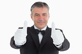 Pleased waiter having thumbs up