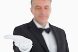 Waiter showing his opened hand