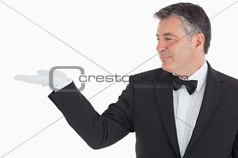 Waiter showing us his opened hand