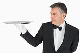 Man holding a silver tray