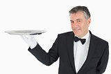 Waiter holding a silver tray