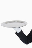 White gloved hand holding a silver tray