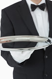 Waiter holding silver tray