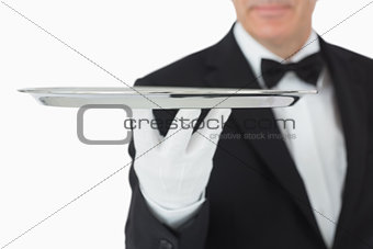 Waiter balancing silver tray