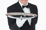Smiling man holding a silver tray