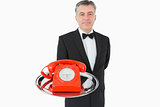 Waiter holding red phone
