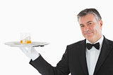 Man posing with whiskey on tray