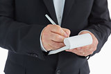 Waiter writing in notepad