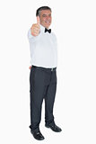 Man in suit showing thumb up