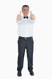 Man in suit showing both thumbs up