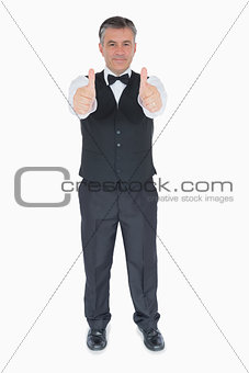 Man in suit with thumbs up