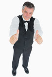 Smiling waiter with thumbs up