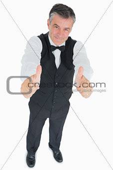 Smiling waiter with thumbs up