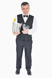 Waiter holding glasses and champagne cooler