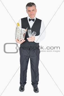 Waiter holding glasses and champagne cooler