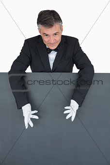 Waiter showing the grey board