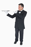 Waiter presenting empty tray
