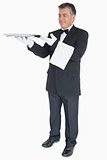 Waiter holding up empty tray