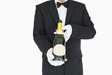 Waiter holding champagne bottle