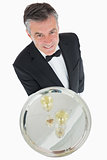 Waiter with silver tray of champagne