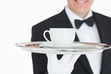 Waiter serving coffee