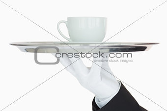 Silver tray with cup of coffee