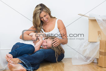 Daughter resting on the mother\'s legs