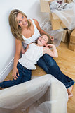 Mother and daughter resting after unpacking