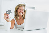 Woman using laptop for online shopping